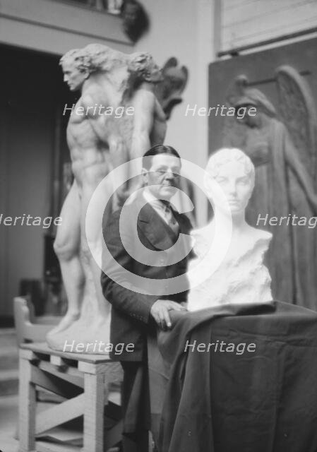 Patigian, Haig, Mr., with his sculptures, portrait photograph, 1927 Creator: Arnold Genthe.