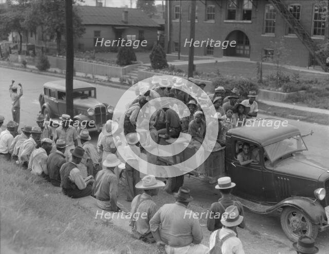 Cotton hoers loading at Memphis, Tennessee for the day's work in Arkansas, 1937. Creator: Dorothea Lange.