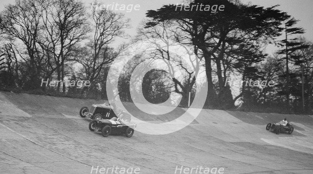 Lea-Francis Hyper of AS Llewellyn and Amilcar of Major A Gardner, BARC meeting, Brooklands, 1930. Artist: Bill Brunell.