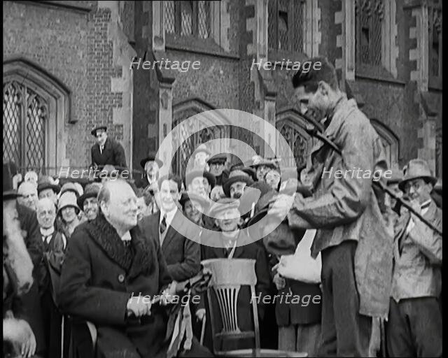 Winston Churchill, Chancellor of the Exchequer, Being Presented With an Irish Cap in Front..., 1926. Creator: British Pathe Ltd.