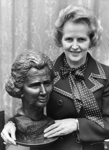 Margaret Thatcher pictured with a bronze bust at the House of Commons, 12th November 1975. Artist: Unknown
