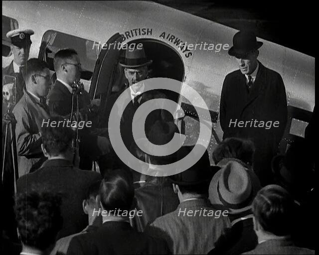 The British Prime Minister, Neville Chamberlain, Standing at the Door of a Lockheed Aero..., 1938. Creator: British Pathe Ltd.