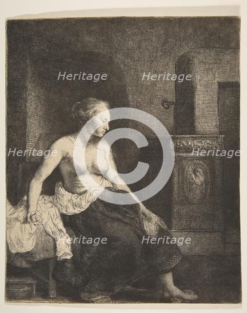 Woman Sitting Half-Dressed beside a Stove, 1658. Creator: Rembrandt Harmensz van Rijn.