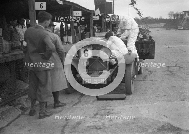 Talbot 90 of E and SJ Burt in the pits at the JCC Double Twelve race, Brooklands,  May 1931. Artist: Bill Brunell.