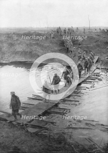 German prisoners on a duckboard track at the Yser Canal, Belgium, 31 July 1917. Artist: Unknown