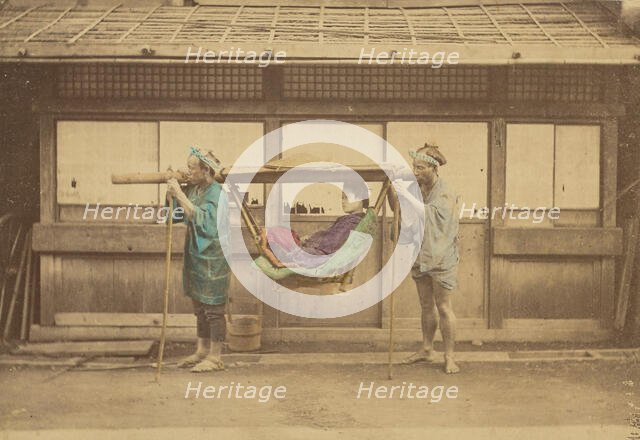 Japanese woman being carried by two Japanese men in a kago, 1868-1880. Creator: Felice Beato.