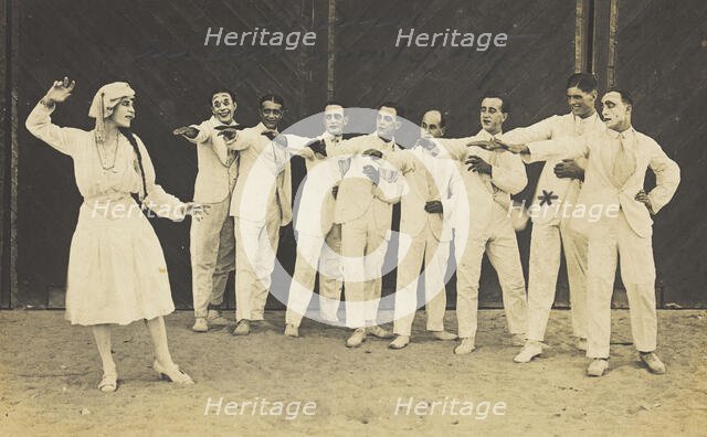 Actors, one in drag, performing on stage as "The Curios",  c1918-1920. Creator: Unknown.