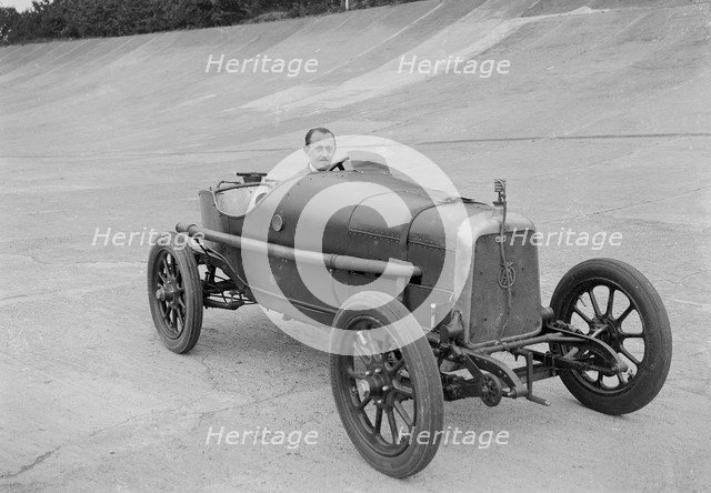 Aston Martin of GC Stead on the Members Banking at Brooklands, Surrey, c1920s. Artist: Bill Brunell.