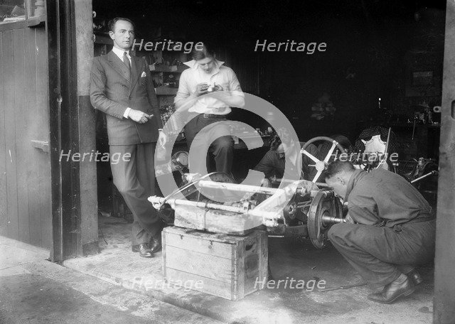 Working on the chassis of Raymond Mays' 2996 cc Vauxhall-Villiers. Artist: Bill Brunell.