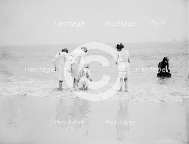 Baby's first lesson, between 1900 and 1905. Creator: Unknown.