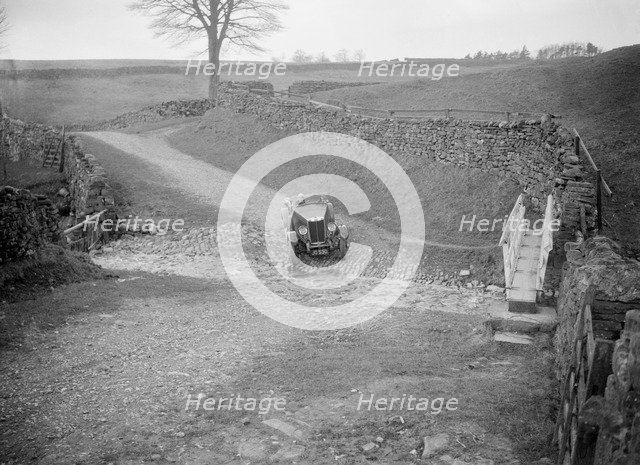 Kitty Brunell road testing a MG 18/80, Tan Hill, Yorkshire, April 1931. Artist: Bill Brunell.