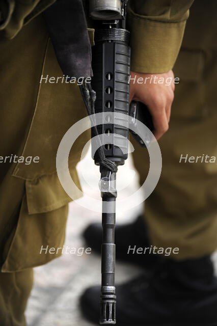 Firearm detail, soldier at the Western Wall, Jerusalem, Israel, 2013. Creator: LTL.
