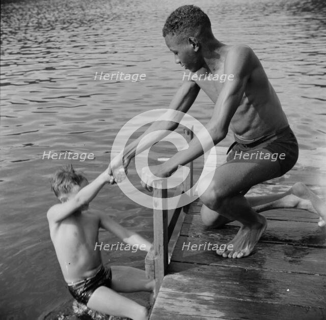 A scene at the swimming dock, Camp Nathan Hale, Southfields, New York, 1943 Creator: Gordon Parks.