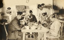 Wounded soldiers in pottery class...Devon, First World War, 1914-1918, (1933).  Creator: Unknown.