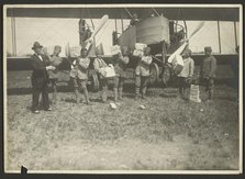 People loading supplies on airplane, 1919-1930. Creator: Fédèle Azari.