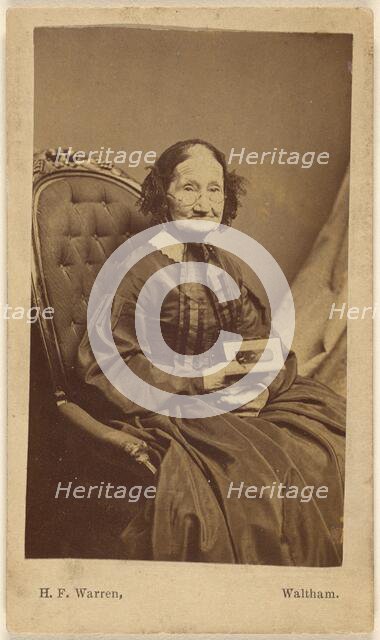 Elderly woman holding a photograph, about 1865. Creator: Henry F Warren.