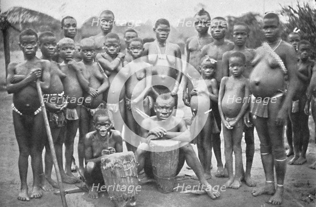 Bambute Pygmy group with two Walese women, 1902. Artist: Unknown.