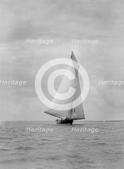 The cutter racing yacht 'Terpsichore' running downwind, 1922. Creator: Kirk & Sons of Cowes.