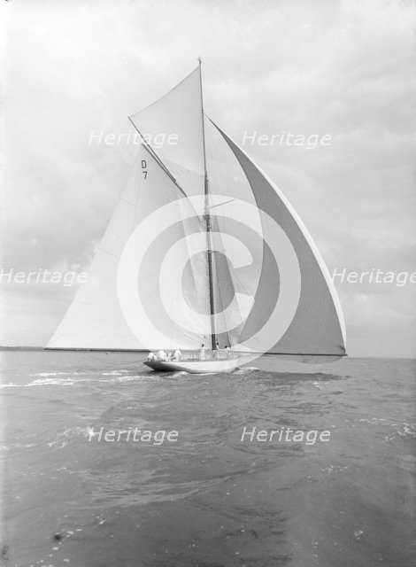 'Istria' sailing downwind under spinnaker, viewed from stern, 1912.  Creator: Kirk & Sons of Cowes.