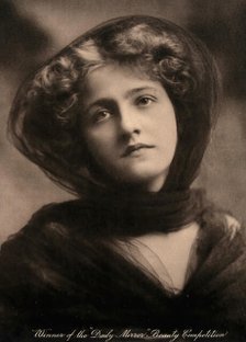 A young woman, winner of a beauty contest, wearing a large black hat with a trailing scarf..., c1904 Creator: Unknown.