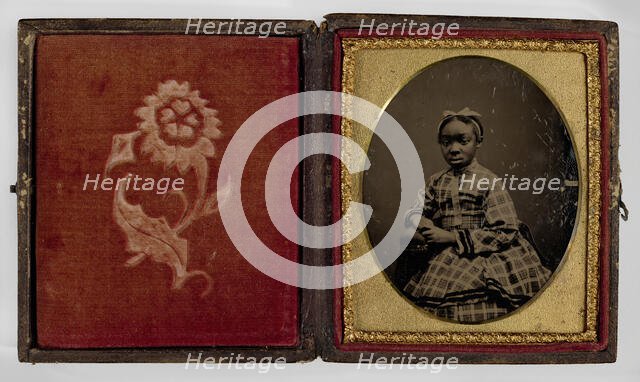 Tintype of a girl in a plaid dress, 1870s. Creator: Unknown.