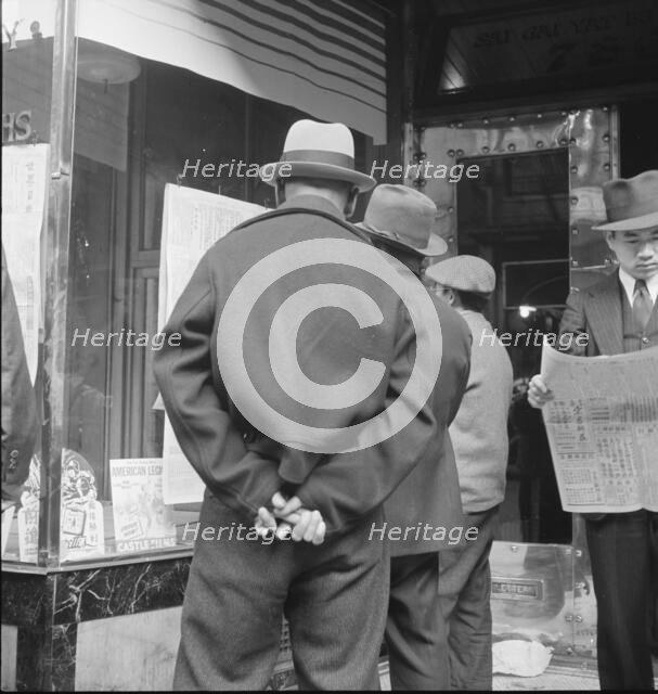 News of the surrender of Canton, San Francisco, California, 1938. Creator: Dorothea Lange.