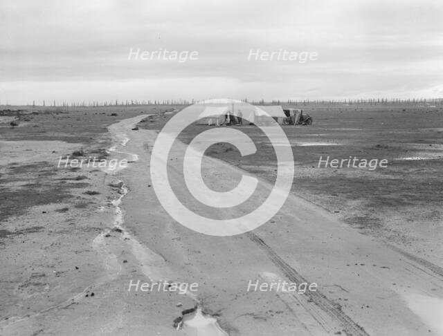 Camp of two related families seen from U.S. 99., Kern County, California, 1939. Creator: Dorothea Lange.