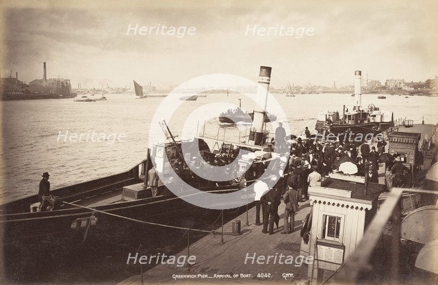 A paddle steamer disembarking passengers at Greenwich Pier, London, c1890. Artist: Unknown