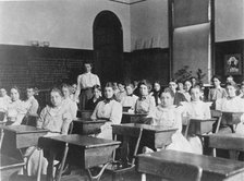 Children seated in classroom, Washington, D.C., (1899?). Creator: Frances Benjamin Johnston.