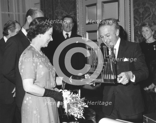 Greville Janner presents the Queen with a menorah, December 1982. Artist: Sidney Harris