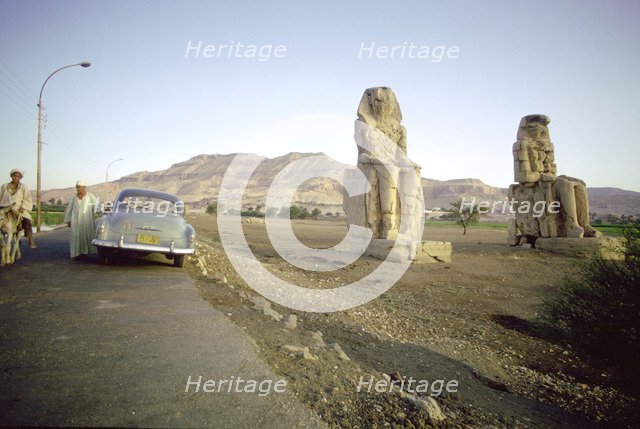 Roadside view of the Colossi of Memnon, Luxor Thebes), Egypt. Artist: Tony Evans