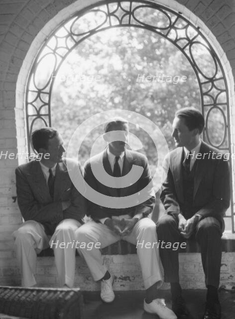 Brady, Mosely, and Scott group, seated in a window, 1930 May 24. Creator: Arnold Genthe.