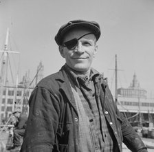 Dock stevedore at the Fulton fish market, New York, 1943. Creator: Gordon Parks.