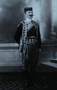 A Montenegrin man wearing national dress and a Montenegrin cap. Creator: Unknown.