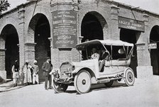 Two men in a car outside the Wellcome pharmaceutical depot in the Middle East, c1900s. Creator: Unknown.