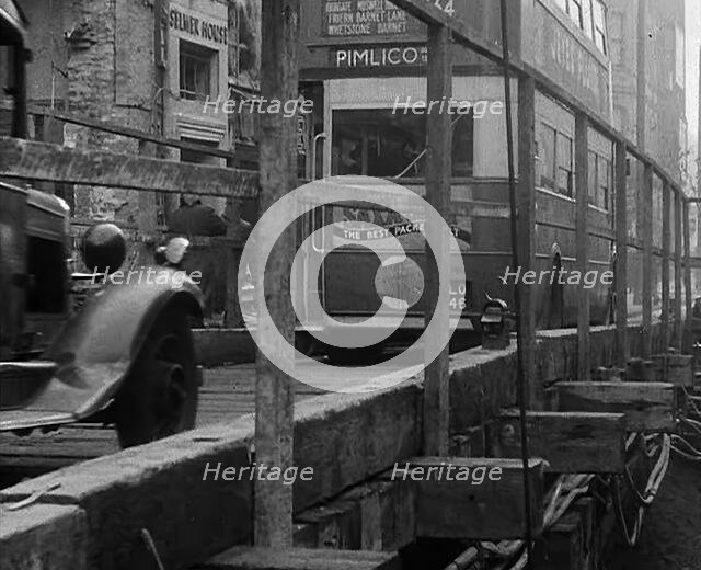 A Bus Driving Across a Wooden Bridge, 1940. Creator: British Pathe Ltd.