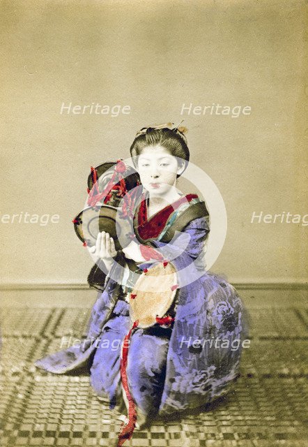 Geisha playing the tsuzumi, Japan, 1882. Artist: Felice Beato