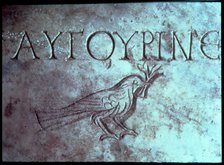 Gravestone with the figure of a dove or a sparrow in the Catacombs of San Calixtus.