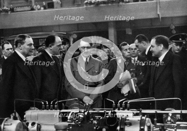 Adolf Hitler at a car show in Berlin, Germany, 1935. Artist: Unknown