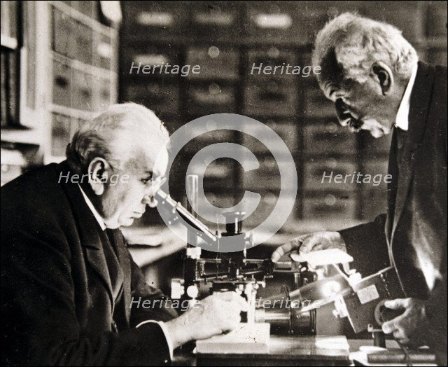 Louis and Auguste Lumière (1864-1948 and 1862-1954), French chemists and biologists in their labo…