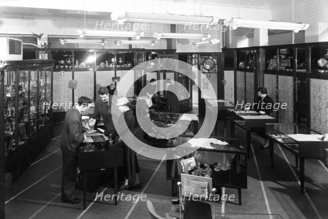 Customers in the Barnsley Co-op jewellery department, South Yorkshire, 1957.   Artist: Michael Walters