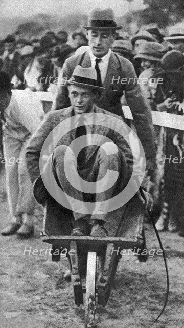 Louis Mountbatten wheels his cousin, the Prince of Wales, at a gymkhana in Malta, 1936. Artist: Unknown