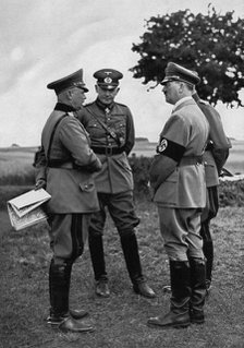Adolf Hitler with senior German army officers, Munster training area, Germany, 1935. Artist: Unknown