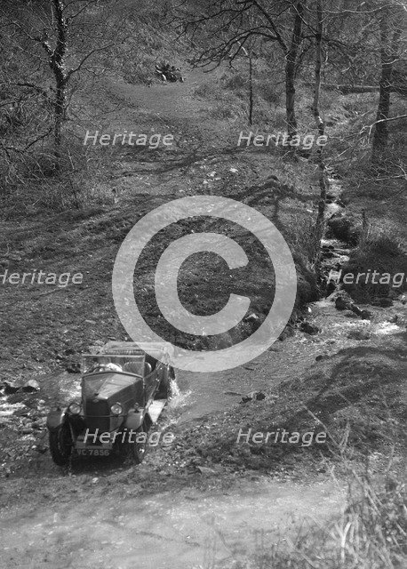 Kitty Brunell road testing a Riley 9 WD tourer, c1930. Artist: Bill Brunell.