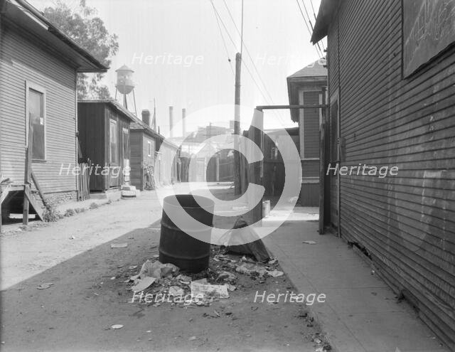 Mexican quarter of Los Angeles, one quarter mile from City Hall, California, 1936. Creator: Dorothea Lange.
