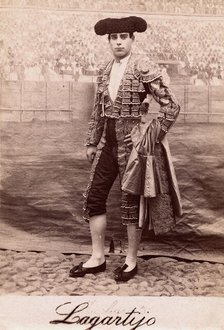 A bullfighter, Rafael Molina Sanchez "Lagartijo", posing in front of a painted back..., c1870s. Creator: Unknown.