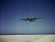 Transport plane takes off on test flight, Consolidated Aircraft Corp., Fort Worth, Texas, 1942. Creator: Howard Hollem.