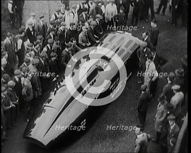 Sir Henry Segrave AKA Major Segrave's Car 'Sunbeam' Being Pushed By a Crowd of Civilians, 1927. Creator: British Pathe Ltd.