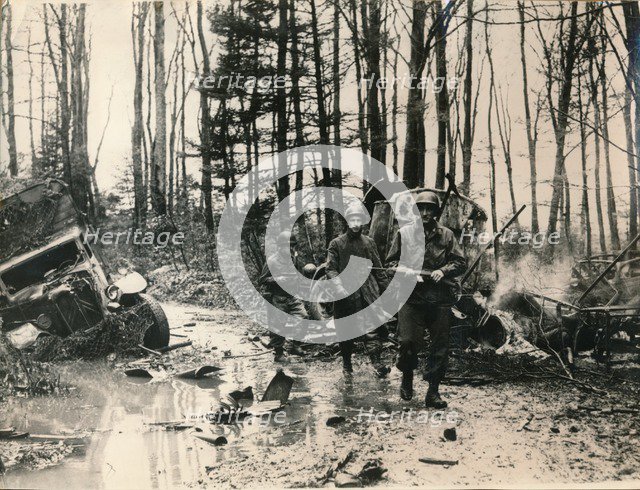 Wrecked German vehicles in a forest on the road to Saverne, November 1944. Artist: Unknown
