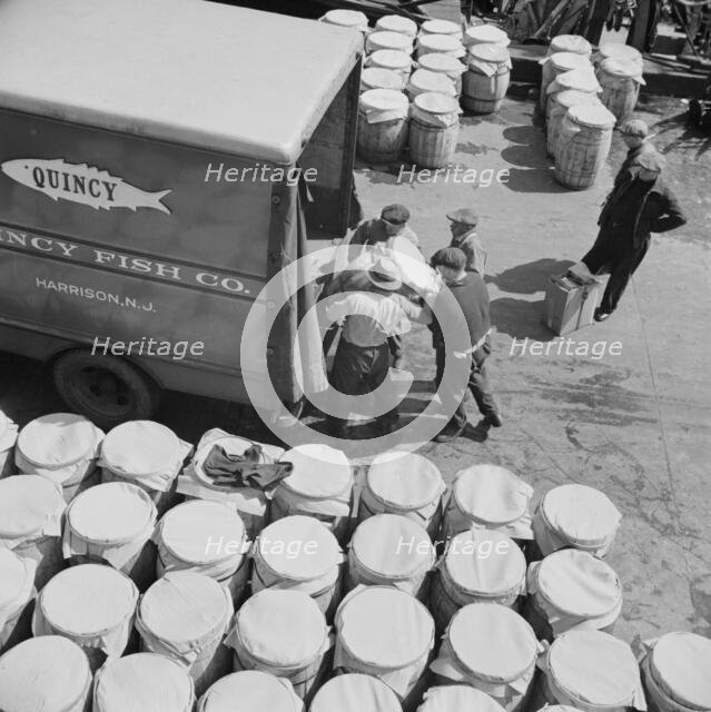 Barrels of fish on the docks at Fulton fish market ready to be shipped to retailers, New York, 1943. Creator: Gordon Parks.
